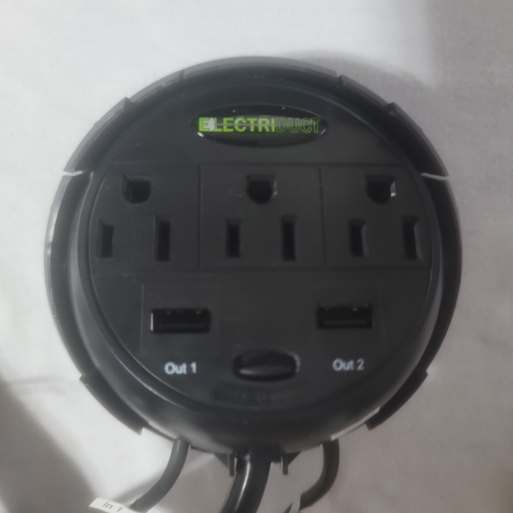 Power tap grommet with hidden power center